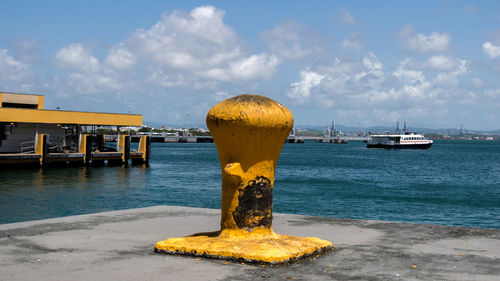 Close-up of yellow sea against sky