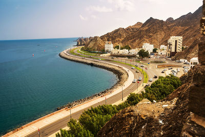 High angle view of road by sea against sky