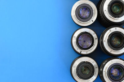 High angle view of lens on blue background