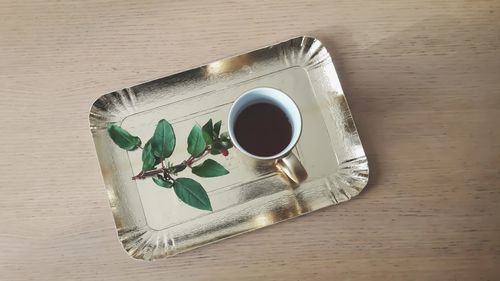 High angle view of coffee cup on table