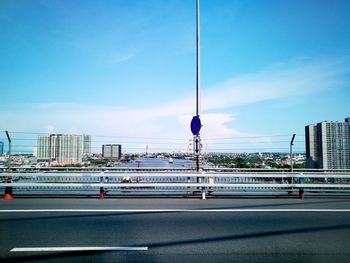 Road in city against sky