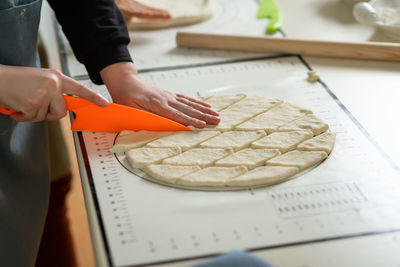 Midsection of man working on table