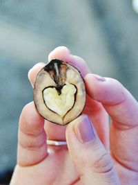 Close-up of hand holding small bread