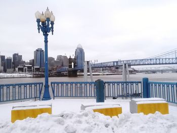 Buildings against cloudy sky during winter