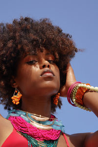 Portrait of a young black woman wearing colorful jewelry