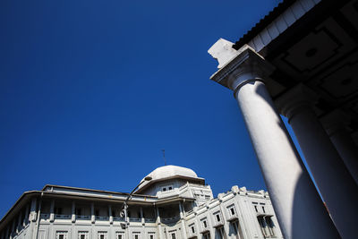 Low angle view of building against blue sky