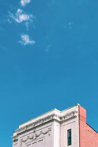 Low angle view of building against blue sky