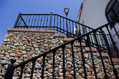 Low angle view of building steps against clear sky