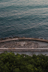 High angle view of sea against trees