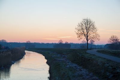 Scenic view of landscape against sky during sunset