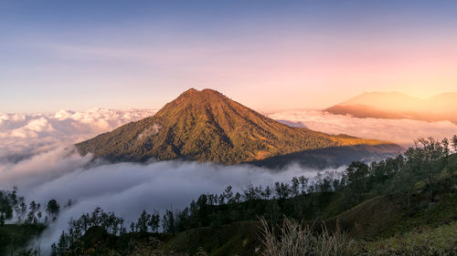 Panoramic view of volcanic landscape against sky during sunset