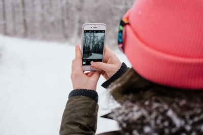 Man photographing with mobile phone