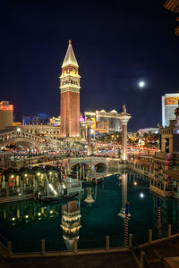 Illuminated buildings in city at night