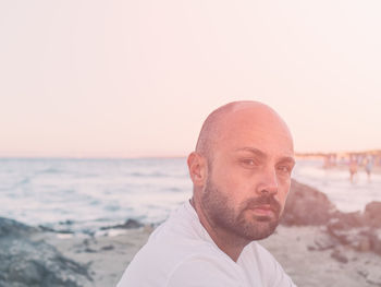 Portrait of man against sea against clear sky