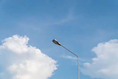 Low angle view of street light against sky