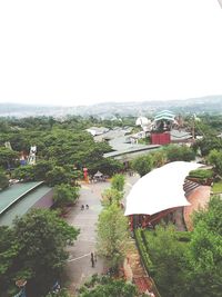 People on landscape against clear sky