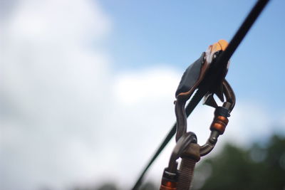 Low angle view of ropes against sky