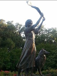 Low angle view of statue against sky