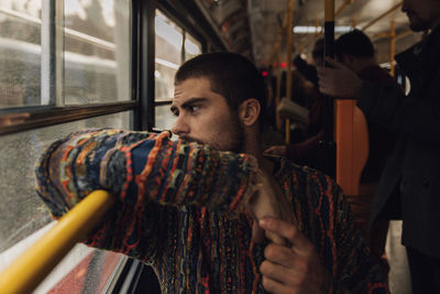 Man looking though window in bus