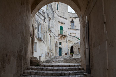 Narrow alley amidst buildings in city