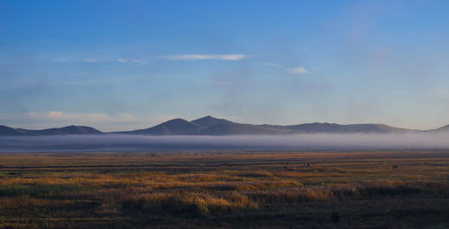 Scenic view of mountains against sky