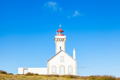 Low angle view of building against blue sky