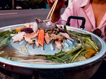 Thai buffet with pork, chicken and other meats, cooked on barbecue pan