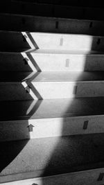 High angle view of shadow falling on staircase