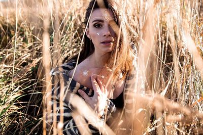 Portrait of a young woman in field