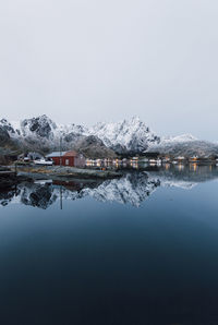 Scenic view of lake against clear sky during winter