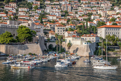 Boats moored at harbor