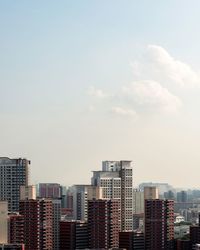 Modern buildings in city against sky