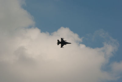 Low angle view of airplane flying in sky