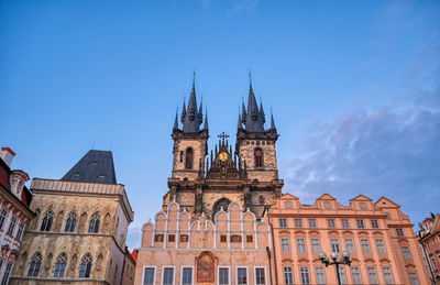 Low angle view of historic building against blue sky