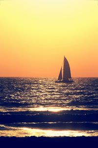 Scenic view of sea against clear sky during sunset