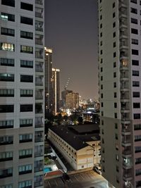 Modern buildings in city at night