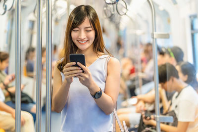 Young woman using mobile phone