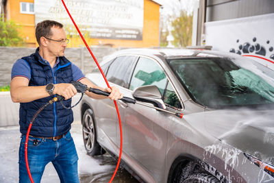 Man holding car