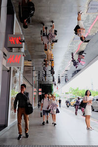 Group of people walking in city