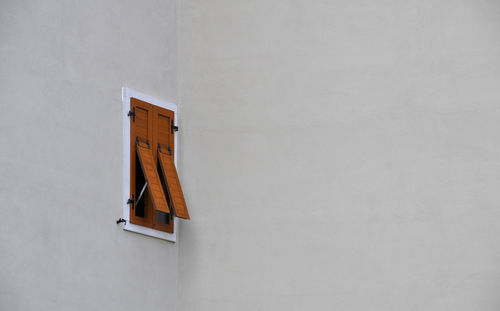 Low angle view of building against white wall