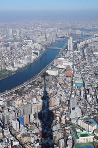 High angle view of illuminated city buildings against sky