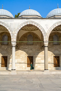 Woman in green dress exploring istanbul on a sunny vacation day