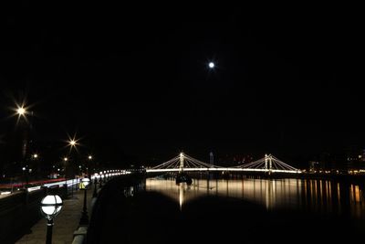 Bridge over river at night