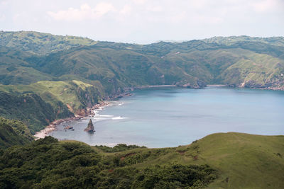 High angle view of land and sea against sky