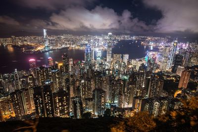 High angle view of illuminated city buildings at night