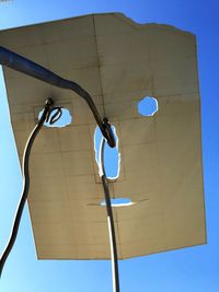 Low angle view of street light against clear blue sky