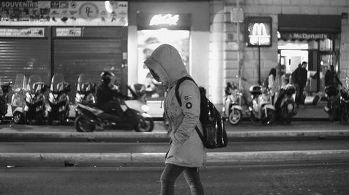 People walking on street in city