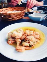 Close-up of prawns in plate on table
