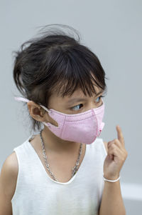 Close-up of girl wearing mask