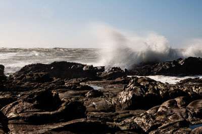 Long exposure of waves crashing on northern california coastal rocks